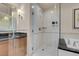 Bathroom featuring vanity, walk-in shower with glass door, and soaking tub at 125 E Harmon Ave # 2220, Las Vegas, NV 89109