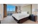 Bright bedroom features floor-to-ceiling windows and a cozy chair at 125 E Harmon Ave # 2220, Las Vegas, NV 89109