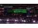 Hotel buildings illuminated in green in Las Vegas at 125 E Harmon Ave # 2220, Las Vegas, NV 89109
