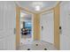Hallway with white tile floors and doors leading to living area with beautiful city views at 125 E Harmon Ave # 2220, Las Vegas, NV 89109