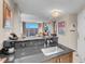 Kitchen counter with sink, appliances and the living room with great views in the background at 125 E Harmon Ave # 2220, Las Vegas, NV 89109