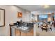 Kitchen counter with sink, appliances and the living room in the background at 125 E Harmon Ave # 2220, Las Vegas, NV 89109