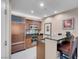 Compact kitchen with stainless steel appliances, wood cabinets, and granite countertops at 125 E Harmon Ave # 2220, Las Vegas, NV 89109