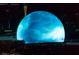 The Las Vegas Sphere illuminated with a cloudy blue design at night at 125 E Harmon Ave # 2220, Las Vegas, NV 89109