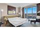 Living room sofa, sleeper, large windows offering expansive city views, and modern artwork at 125 E Harmon Ave # 2220, Las Vegas, NV 89109
