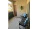 Cozy balcony featuring seating for two, decorative plants, and partial outdoor views at 1725 Queen Victoria St # 103, Las Vegas, NV 89144