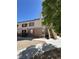 Inviting two-story condo with landscaped front, convenient stairway access, and neutral tones at 1725 Queen Victoria St # 103, Las Vegas, NV 89144