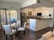 This kitchen features stainless steel appliances, white cabinets, and breakfast bar with seating at 1725 Queen Victoria St # 103, Las Vegas, NV 89144