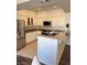 Eat-in kitchen with stone countertops, stainless steel appliances, and white cabinetry at 1725 Queen Victoria St # 103, Las Vegas, NV 89144