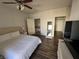 Bedroom featuring a ceiling fan, closet, and a comfortable king bed at 1725 Queen Victoria St # 103, Las Vegas, NV 89144