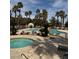 Inviting community pool and spa area with lush landscaping and resort-style amenities at 1725 Queen Victoria St # 103, Las Vegas, NV 89144