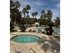 Inviting community pool and spa area with lush landscaping and resort-style amenities at 1725 Queen Victoria St # 103, Las Vegas, NV 89144