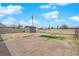 Large backyard with concrete areas and a storage shed at 1813 Constantine Ave, Las Vegas, NV 89101