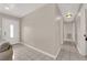 Inviting entryway with neutral paint, white trim, tile flooring, and a secure front door at 1813 Constantine Ave, Las Vegas, NV 89101