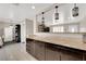 Bright kitchen with granite countertops, tile floors, pendant lighting and stainless steel appliances at 1813 Constantine Ave, Las Vegas, NV 89101