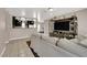 Comfortable living room with stylish decor, opening to the kitchen and dining area at 1813 Constantine Ave, Las Vegas, NV 89101