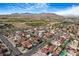Extensive aerial view of the community with homes, landscaping, and mountainous background at 182 Horizon View Dr, Henderson, NV 89015