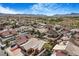 Wide aerial view of the neighborhood with neat homes, landscaping, and mountain views at 182 Horizon View Dr, Henderson, NV 89015