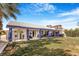 Expansive backyard with lush lawn and a covered patio, perfect for outdoor entertaining and relaxation at 182 Horizon View Dr, Henderson, NV 89015