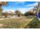Spacious backyard with a well-kept lawn and mature trees, offering plenty of room for recreation at 182 Horizon View Dr, Henderson, NV 89015