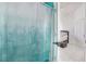 Shower room with turquoise-to-white shower curtain and white tile at 182 Horizon View Dr, Henderson, NV 89015