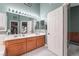 Bathroom featuring a double sink vanity, a large mirror, and ample storage at 182 Horizon View Dr, Henderson, NV 89015