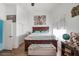 Bedroom features wood floors, art, and large windows for plenty of natural light at 182 Horizon View Dr, Henderson, NV 89015