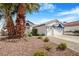 Charming single-Gathering home with a large three car garage, a manicured yard and a beautiful palm tree at 182 Horizon View Dr, Henderson, NV 89015