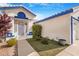 Charming single-Gathering home featuring a gated front porch, white paint and blue trim at 182 Horizon View Dr, Henderson, NV 89015