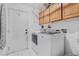 Functional laundry room with washer, dryer, and storage cabinets at 182 Horizon View Dr, Henderson, NV 89015
