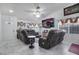 Living room featuring high ceilings, tile floors, modern ceiling fan, TV and comfortable seating at 182 Horizon View Dr, Henderson, NV 89015