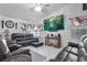 Comfortable living room with tile floors, TV and lots of seating at 182 Horizon View Dr, Henderson, NV 89015