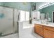 Modern main bathroom with glass shower, soaking tub, and custom cabinets at 182 Horizon View Dr, Henderson, NV 89015