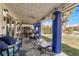 Inviting covered patio featuring comfortable seating, a ceiling fan, and an outdoor television at 182 Horizon View Dr, Henderson, NV 89015