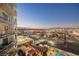 High-rise balcony view of city skyline, offering panoramic views and glimpses of a pool at 200 W Sahara Ave # 1810, Las Vegas, NV 89102