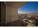 Balcony view overlooking the cityscape, featuring mountain views and city lights at dusk at 200 W Sahara Ave # 1810, Las Vegas, NV 89102