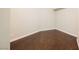 Empty bedroom with dark wood floors, neutral walls, and ample electrical outlets at 200 W Sahara Ave # 1810, Las Vegas, NV 89102