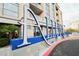 Modern high-rise condo building with striking entrance signage and well-maintained landscaping at 200 W Sahara Ave # 1810, Las Vegas, NV 89102