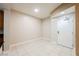 Bright entryway featuring tile floors, neutral walls, and a solid front door at 200 W Sahara Ave # 1810, Las Vegas, NV 89102