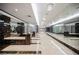 Long hallway with reflective walls and crystal chandeliers; features travertine floors and lounge seating at 200 W Sahara Ave # 1810, Las Vegas, NV 89102
