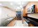 Modern kitchen with granite counters and stainless steel appliances, featuring a view of the city at 200 W Sahara Ave # 1810, Las Vegas, NV 89102