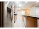 A modern kitchen view of the appliances, granite countertops, and tile flooring at 200 W Sahara Ave # 1810, Las Vegas, NV 89102