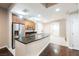 A modern kitchen featuring stainless steel appliances and a granite island at 200 W Sahara Ave # 1810, Las Vegas, NV 89102