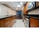 Modern kitchen with stainless appliances, granite counters, and a view at 200 W Sahara Ave # 1810, Las Vegas, NV 89102