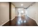An open-concept space with wood floors leading to a modern kitchen and tiled floors at 200 W Sahara Ave # 1810, Las Vegas, NV 89102