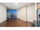 Bright living room with wood floors, large windows, and a kitchen view at 200 W Sahara Ave # 1810, Las Vegas, NV 89102