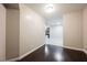Neutral living space showcases hardwood flooring leading to a tiled kitchen area at 200 W Sahara Ave # 1810, Las Vegas, NV 89102