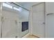 Bright bathroom with a glass shower, tiled walls, and a doorway leading to the rest of the bathroom at 2105 High Mesa Dr, Henderson, NV 89012