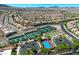 An aerial view of the community showcasing homes, tennis courts, and lush landscaping at 2156 Shadow Canyon Dr, Henderson, NV 89044