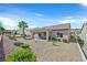 The backyard has desert landscaping, covered patio, and is ready for outdoor living at 2156 Shadow Canyon Dr, Henderson, NV 89044